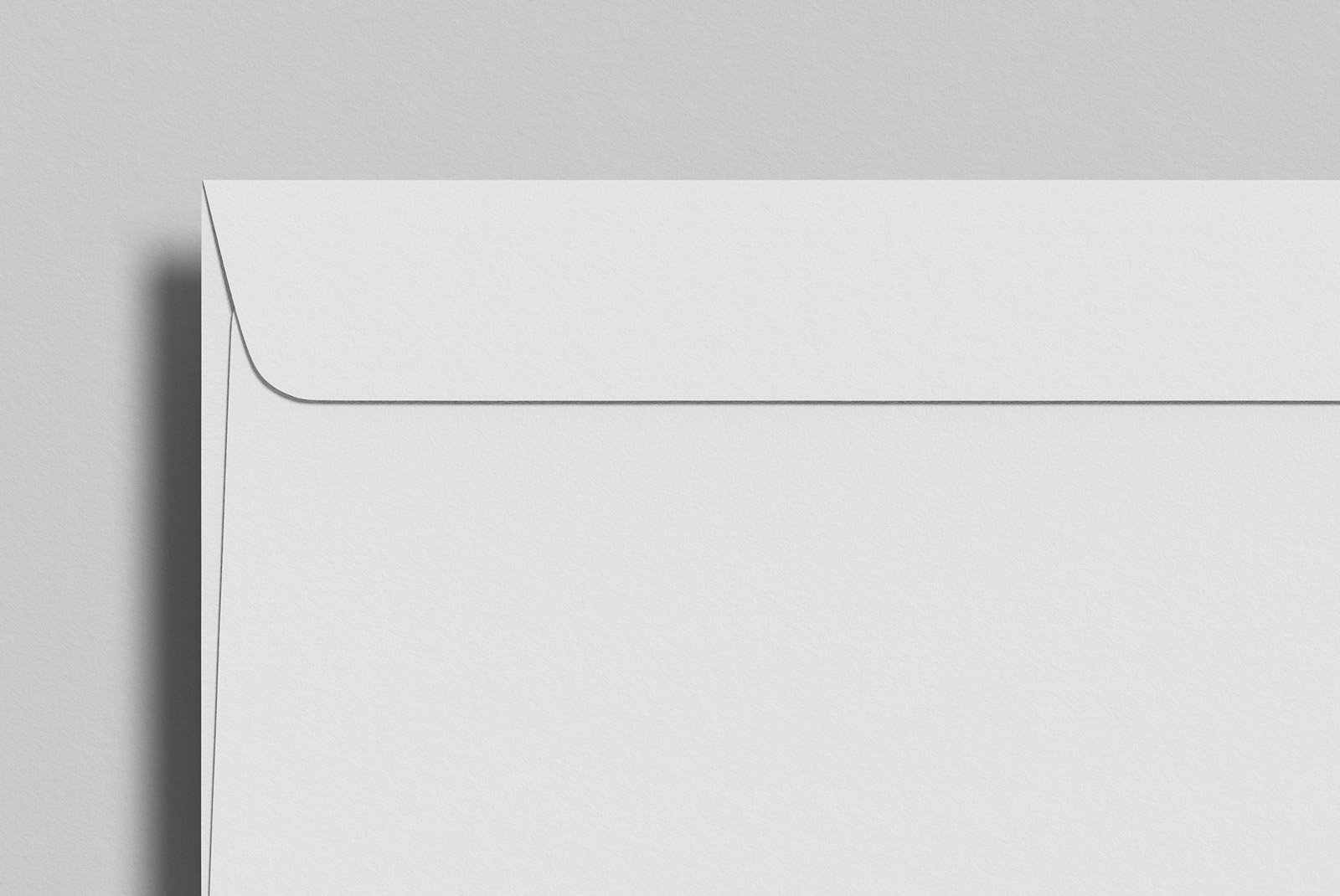White envelope print mockup featuring clean and minimalist design on a light-colored background, ideal for graphic designers and print mockup projects.