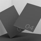 Two floating black booklets with large numbers in a minimalist setting ideal for print mockups and graphic design showcases for digital assets.