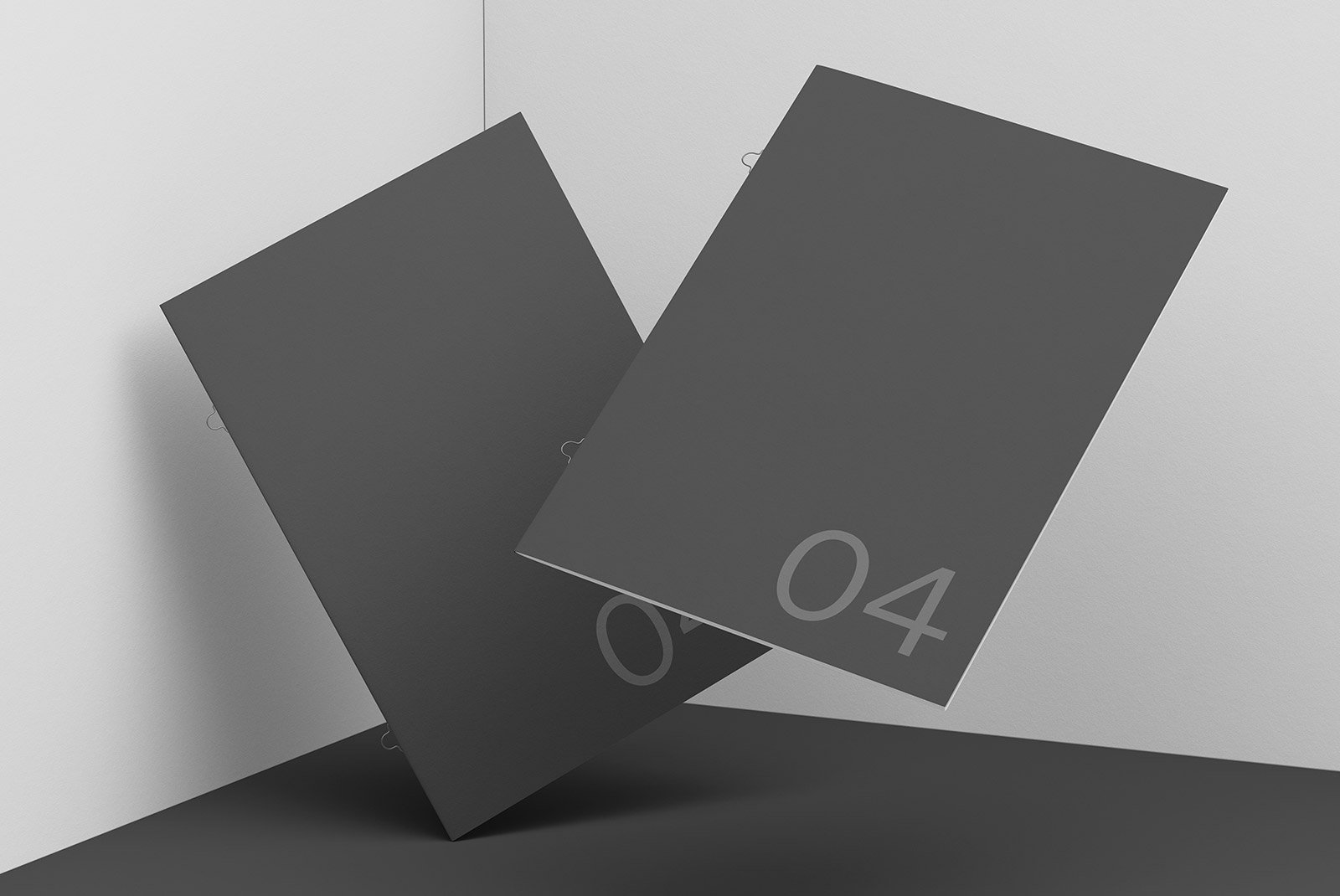 Two floating black booklets with large numbers in a minimalist setting ideal for print mockups and graphic design showcases for digital assets.