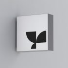 Minimalist wall sign mockup featuring a black geometric logo on a white background. Ideal for branding designers showcasing print or billboard mockups.