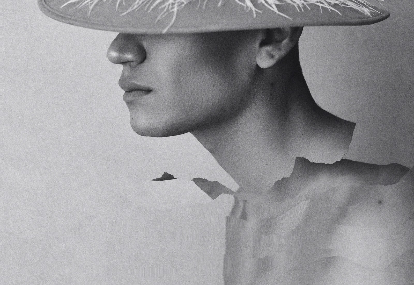 Surrealist graphic with a fragmented face and hat on torn paper effect suitable for graphic designers and Photoshop effects enthusiasts.