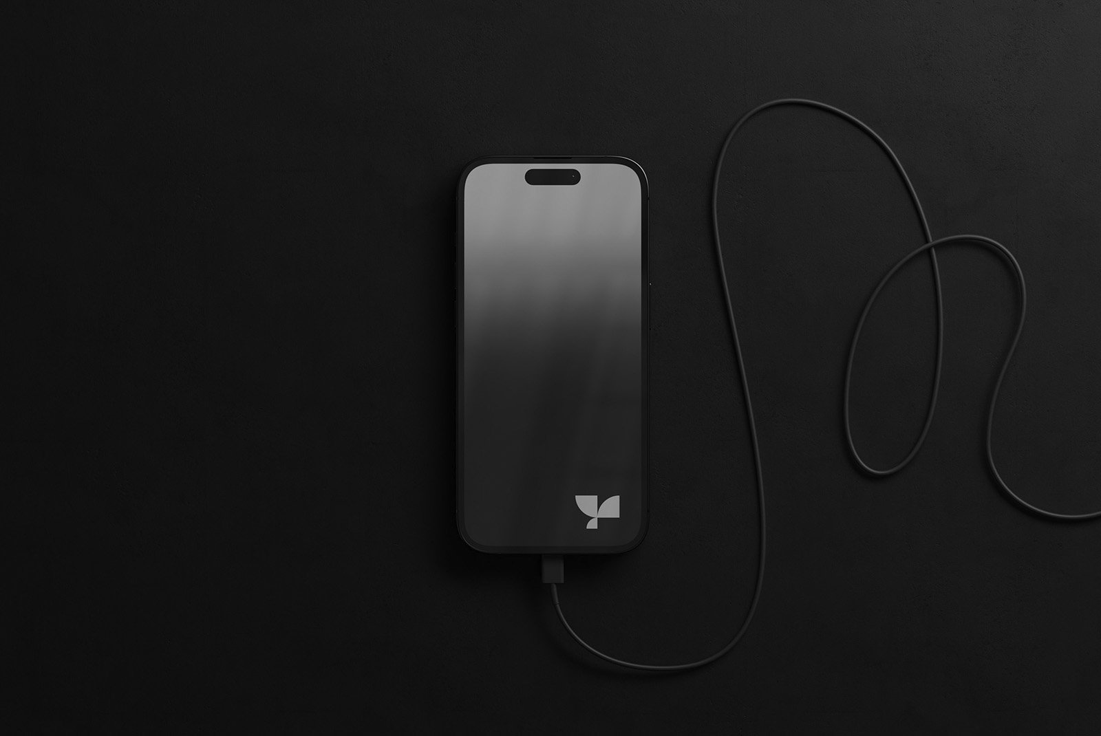 Black smartphone connected by a charging cable on black background perfect for tech mockups designers digital assets sleek minimalistic modern design