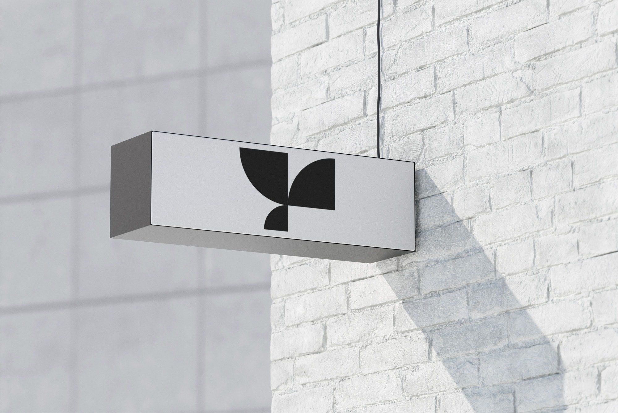 Modern rectangular signboard mockup on white brick wall perfect for branding or storefront advertisements billboard mockups graphic design asset