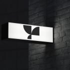 Rectangular billboard mockup on a brick wall with a geometric black logo suitable for graphic designers showcasing outdoor signage branding.
