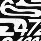 Distorted black and white typography graphic with a grunge texture, showcasing abstract numbers. Ideal for graphic designers looking for unique Photoshop effects.