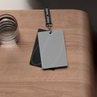 Business card mockups on a wooden desk with a glass of water nearby perfect for graphic designers and digital asset stores showcasing print mockups.