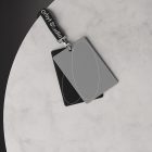 Apparel mockup showing blank lanyard with two ID cards on a marble surface. Ideal for graphic designers seeking realistic ID card designs.