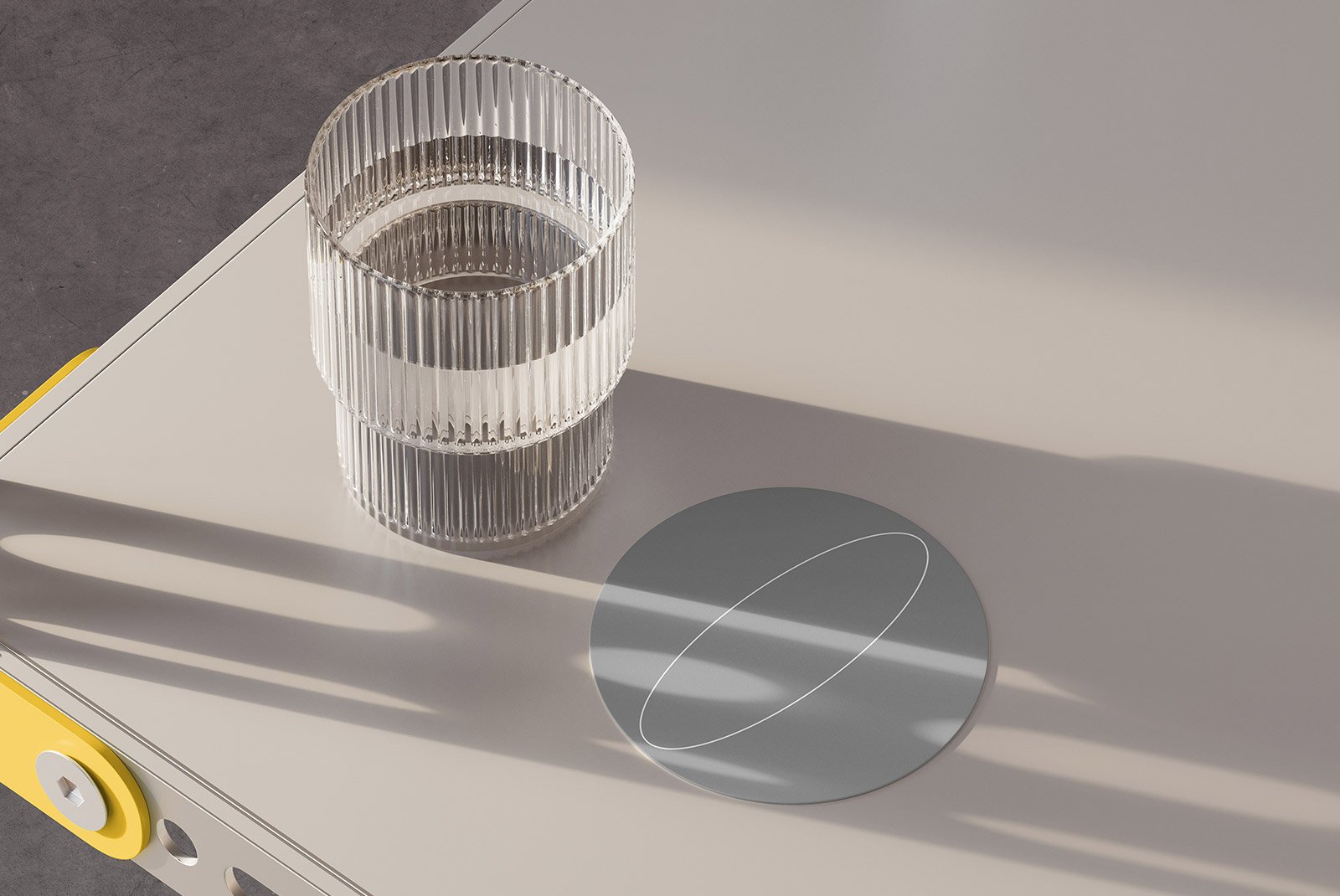 Glass tumbler on a modern desk with round coaster concept. Perfect for print, packaging mockups, and graphic designs for product showcasing.