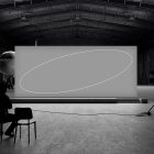 Large airplane hangar with a blank billboard and people watching. Suitable for billboard mockups and advertising design, ideal for graphic designers