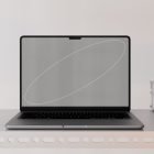 Laptop on a metal shelf with a gray screen mockup showcasing simple graphics. Suitable for tech mockups, graphic designers, digital assets, web design.