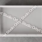 Packaging mockup featuring a transparent plastic bin with Studio Orbyt branding tape, ideal for showcasing designs in print and packaging categories.
