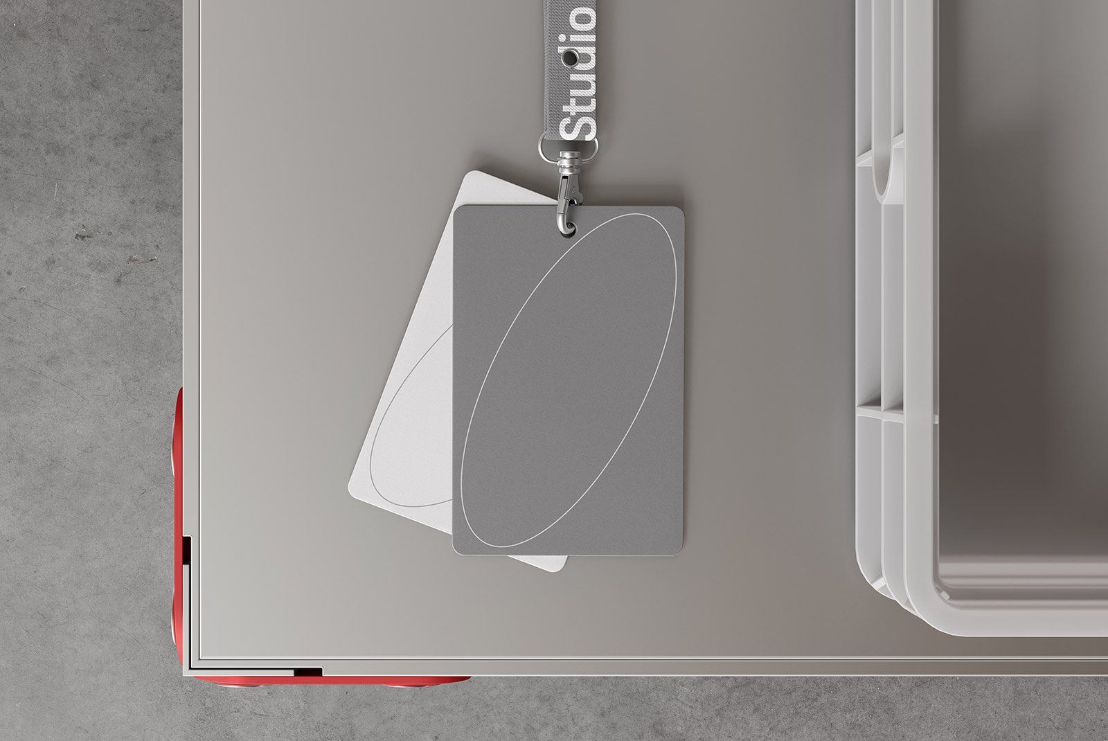 ID card mockup on a keychain lanyard on a grey table. Suitable for tech mockups and graphic designers.