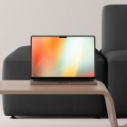 Laptop mockup on a minimalist wooden table with grey couch in the background ideal for tech mockups retail store digital assets design graphic design resource