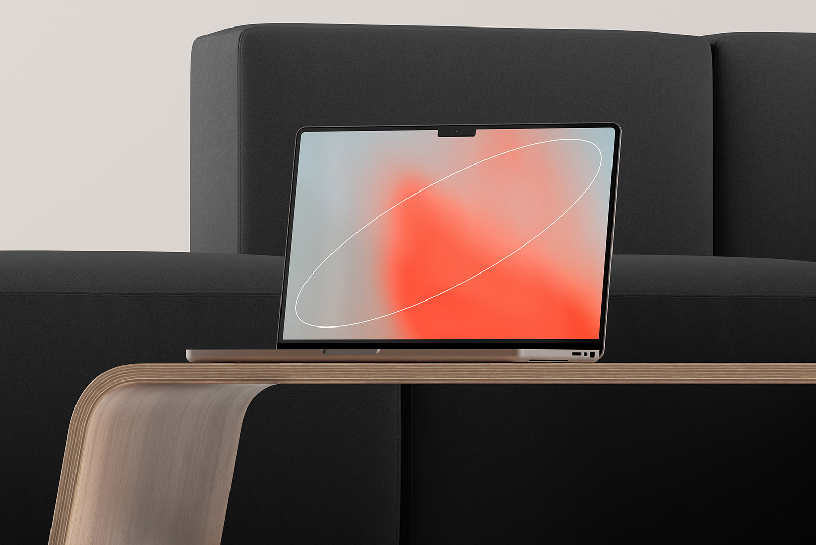 Laptop mockup on wooden table against black couch, ideal for tech mockups and digital presentations. Minimalistic design, perfect for graphic designers and marketers.