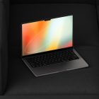 Laptop mockup with an abstract multicolor screen on a black fabric surface, ideal for tech presentations, graphic design projects, and digital asset showcases.
