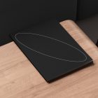 Black print mockup book on a wooden desk with minimalistic design suitable for digital assets store geared towards graphic designers and mockup resources.