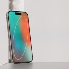 Smartphone mockup displaying a colorful screen leaning against a modern metal stand suitable for tech design projects and digital assets for graphic designers.