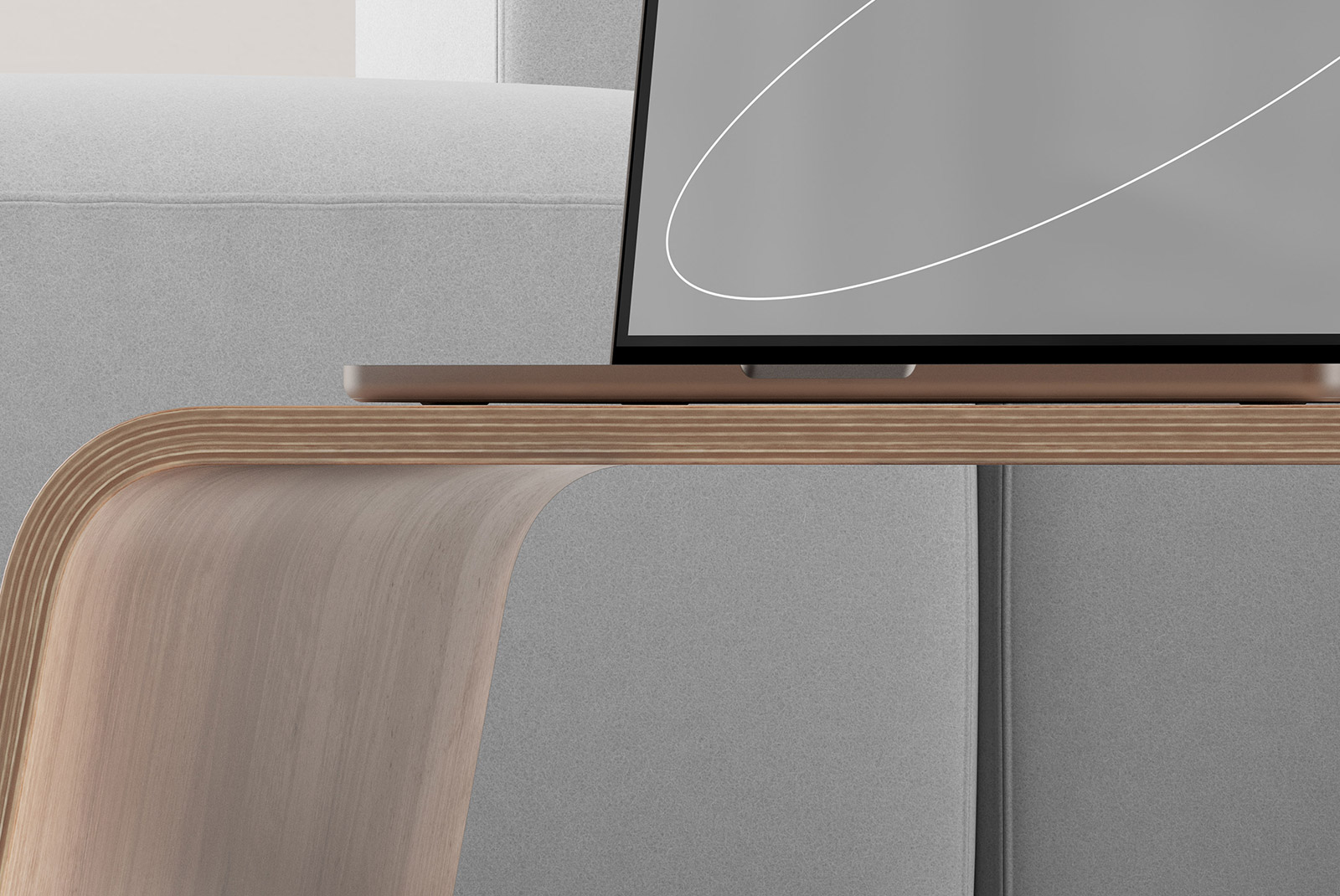 Wooden laptop stand on grey couch setup tech mockup featuring minimalist design and modern workspace for graphic designers and digital artists.
